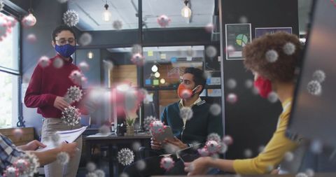 Colleagues Debating in Office with COVID-19 Reminder Visual