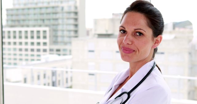 Confident Female Doctor with Stethoscope in Urban Hospital Setting - Download Free Stock Images Pikwizard.com