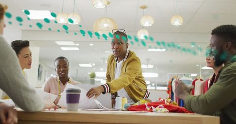 Diverse Team Discussing Business Reports in Modern Office