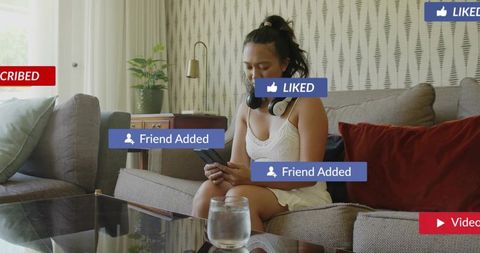 Young woman scrolling smartphone on sofa wearing camisole and shorts with social media overlays