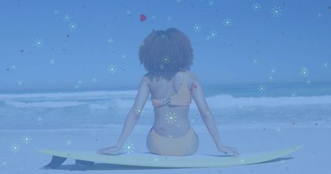 Woman in Yellow Bikini Relaxing with Surfboard on Tranquil Beach