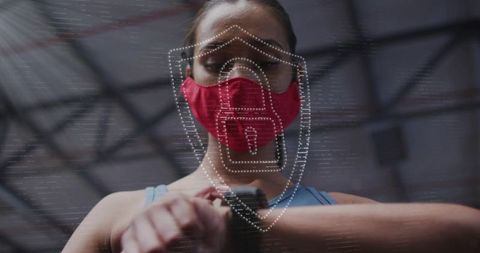 Female athlete using smartwatch with augmented reality shield overlay wearing red mask