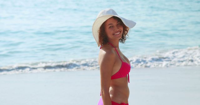 Smiling Woman in Pink Bikini with Sun Hat on Beach - Download Free Stock Images Pikwizard.com