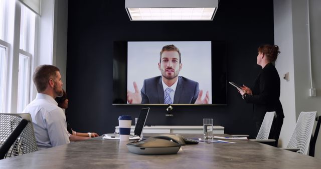 Business Team in Video Conference with Colleague in Modern Office - Download Free Stock Images Pikwizard.com