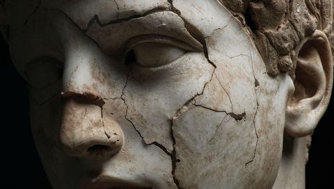 Cracked Marble Head Sculpture Damaged Nose Dramatic Chiaroscuro Museum Patina Close-up