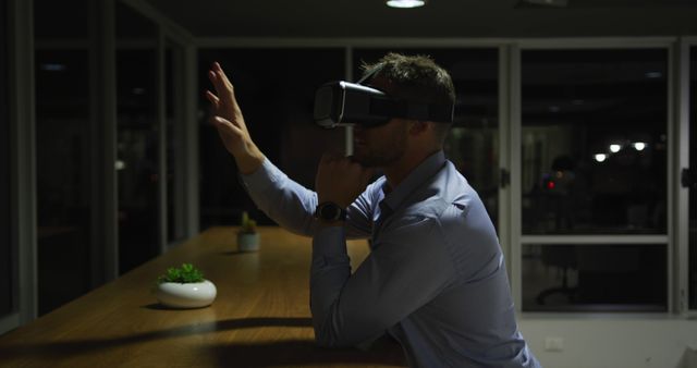 Man Using Virtual Reality Headset in Office Environment - Download Free Stock Images Pikwizard.com