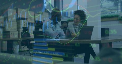 Business Colleagues Analyzing Stock Market Data on Laptop