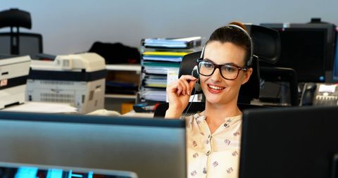 Smiling Businesswoman on Phone in Office Environment - Download Free Stock Images Pikwizard.com