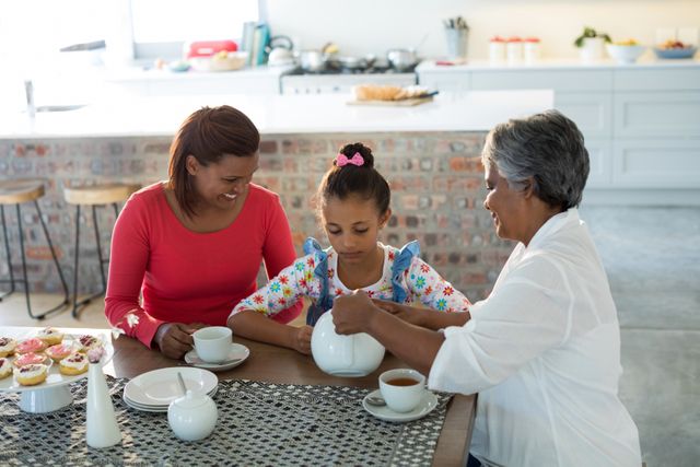 Multi-generation family having tea at home - Download Free Stock Photos Pikwizard.com