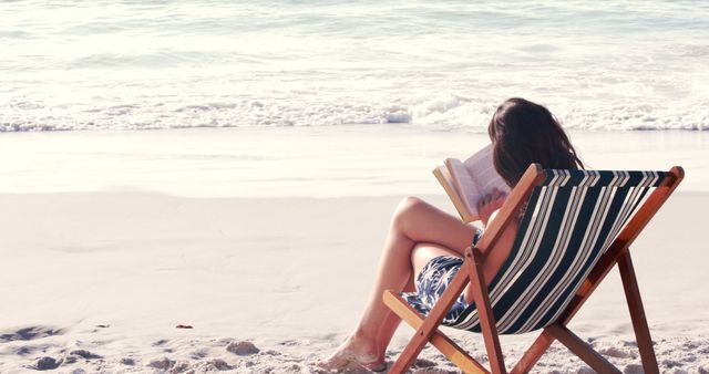 Relaxing Summer Reading on Tranquil Beach - Download Free Stock Images Pikwizard.com