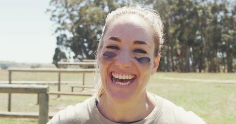 Smiling Female Soldier on Obstacle Course Outdoors