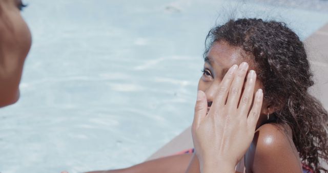 Mother Applying Sunscreen to Young Girl by Outdoor Swimming Pool - Download Free Stock Images Pikwizard.com