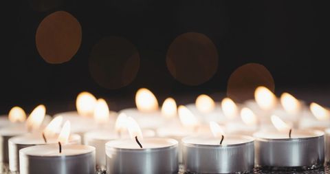 Glowing Tea Lights Creating Cozy Atmosphere in Darkness