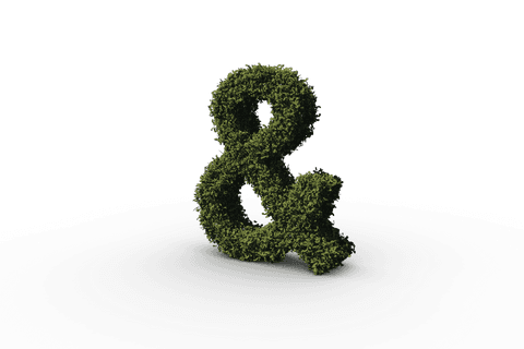 Transparent ampersand shaped from lush green leaves