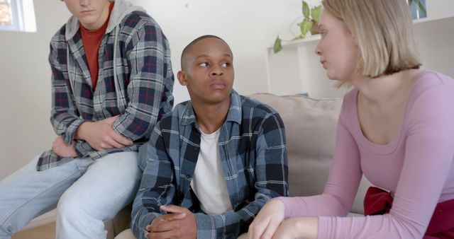 Diverse Teen Friends Having Serious Conversation on Sofa - Download Free Stock Images Pikwizard.com