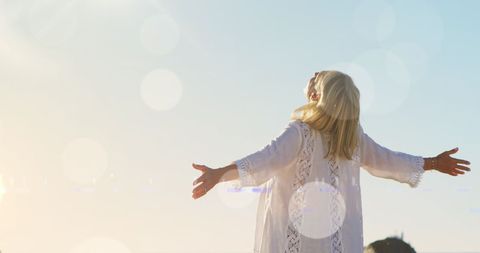 Woman with Outstretched Arms Embracing Sunlight - Download Free Stock Images Pikwizard.com