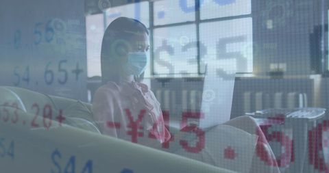 Asian Businesswoman Analyzing Financial Data with Pandemic Awareness