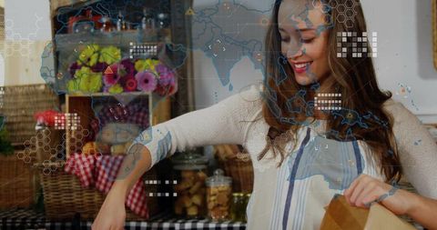 Woman unpacking groceries with digital overlay in cozy kitchen