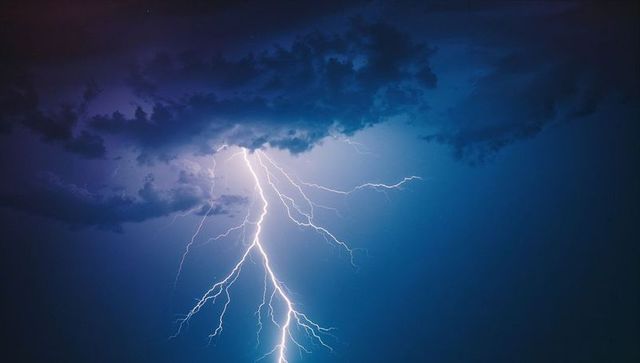 Powerful Forked Lightning Illuminating Night Sky