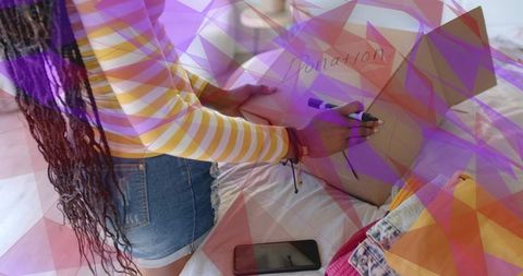 Woman Preparing Donation Box with Clothes in Bedroom