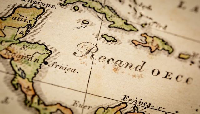 Antique map close-up showing calligraphic place name on aged parchment hand-colored