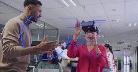 Mid-adult professional using vr headset and interacting with virtual hud in open office