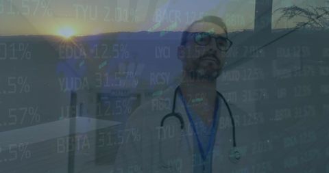 Doctor Analyzing Data with Scenic Sunset Through Large Office Window