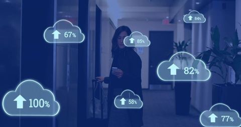 Business traveler holding phone pulling suitcase in hotel corridor with cloud upload graphics