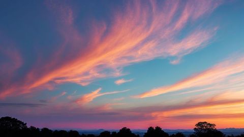 Pastel Clouds Stretching Across Serene Sunset Sky Over Treeline - Download Free Stock Images Pikwizard.com