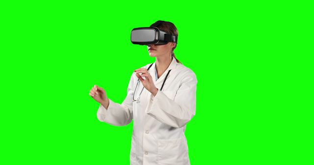Female Doctor Experiencing Virtual Reality with VR Goggles on Green Screen Background - Download Free Stock Images Pikwizard.com