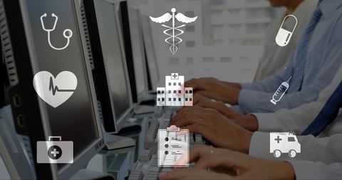Clinicians typing at workstations entering patient data with healthcare icons overlay