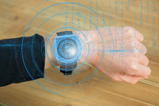 Shows a hand wearing a smartwatch with digital graphics overlay, representing advanced technology and innovation in wearable tech. Use for topics like modern technology, digital interfacing, wearable devices, and future tech innovations.