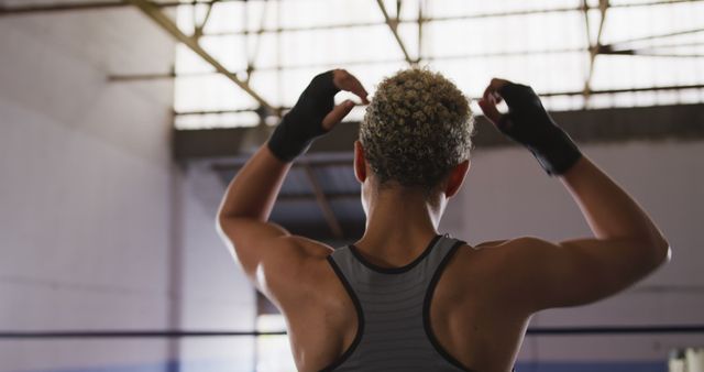 Rear View of Boxer Preparing for Training in Gym - Download Free Stock Images Pikwizard.com