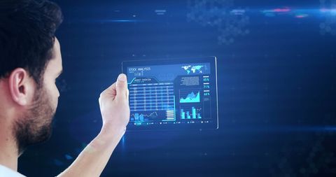 Man Analyzing Data on Digital Tablet in Futuristic Environment - Download Free Stock Images Pikwizard.com