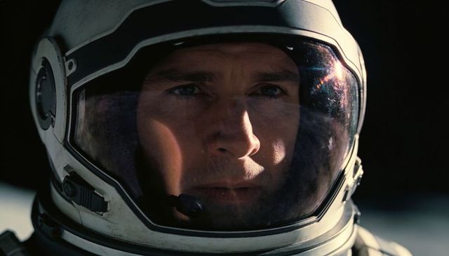 Closeup astronaut portrait with smudged visor, reflections and intense gaze inside helmet