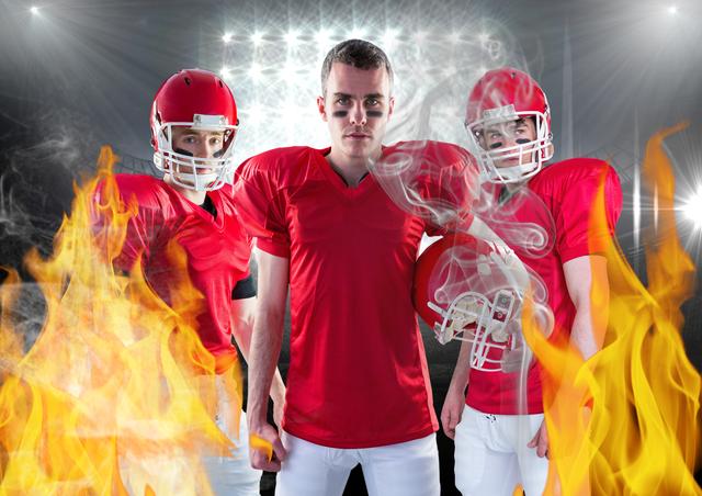Digital composition of american football players standing against fire in background