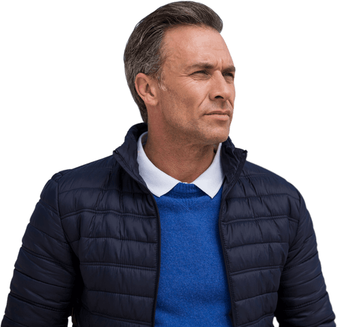 Confident middle-aged man in winter outerwear looking transparent