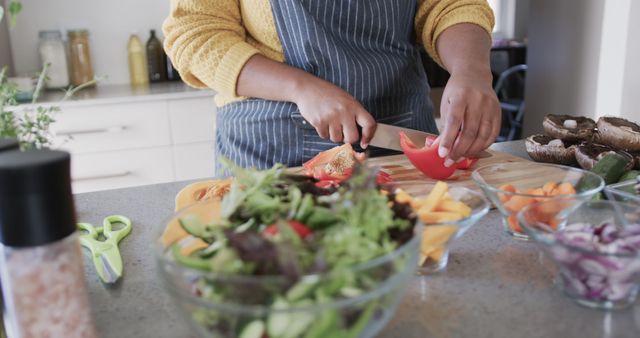 Person Preparing Fresh Salad in Contemporary Kitchen - Download Free Stock Images Pikwizard.com