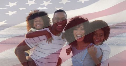 Happy African American Family on Beach with USA Flag