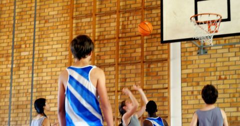 Youth Basketball Game Action in Indoor Gymnasium