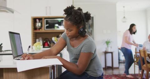 African American Girl Engaging in Online Learning at Home