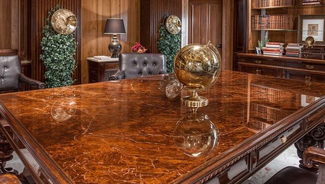 Luxurious executive library with marble table and globe detail