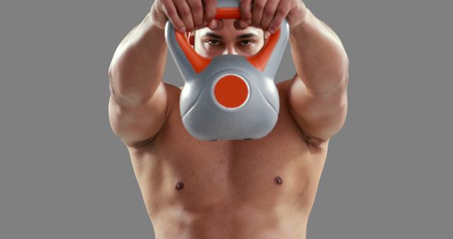 Muscular Man Lifting Kettlebell During Workout - Download Free Stock Images Pikwizard.com