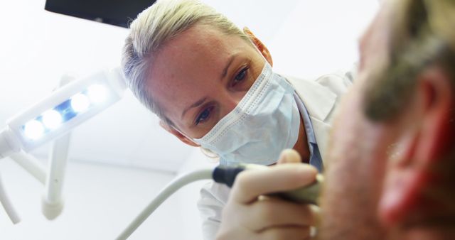 Female Dentist Examining Patient in Dental Office - Download Free Stock Images Pikwizard.com