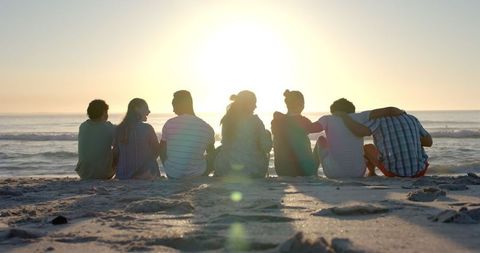 Diverse Friends Enjoying Serene Beach Sunset together - Download Free Stock Images Pikwizard.com