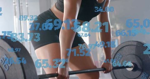 Female athlete performing barbell deadlift wearing black sportswear digital performance data overlay