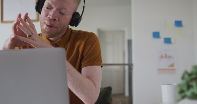 Focused man in headphones working from home on laptop - Download Free Stock Images Pikwizard.com