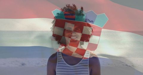 Standing smiling young man on beach with croatian flag overlay patriotic travel concept