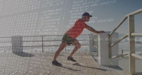 Athlete Uses Technology While Stretching on Coastal Boardwalk