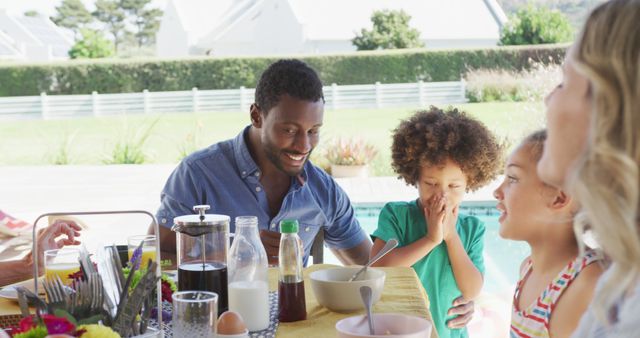 Image of diverse family spending time together and having dinner outside. Family life, spending time together with family.